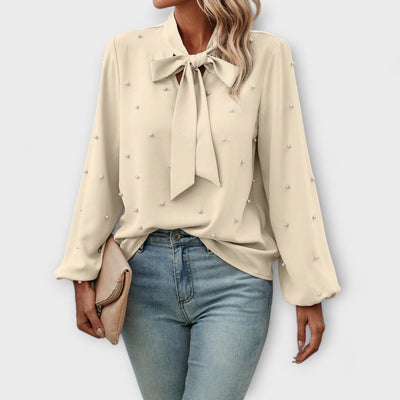 Sophia – Blouse élégante avec détails en perles et nœud