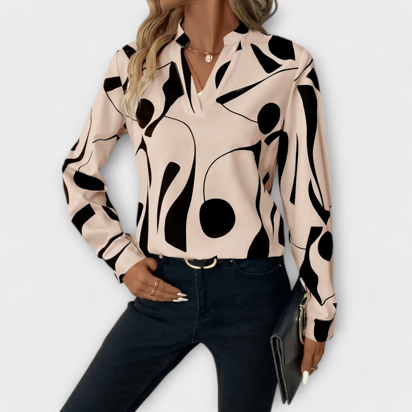 Blouse élégante à manches longues avec décolleté en V et motif géométrique