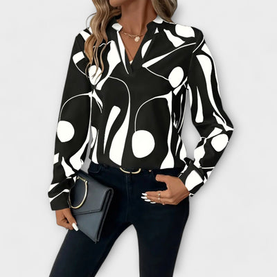 Blouse élégante à manches longues avec décolleté en V et motif géométrique